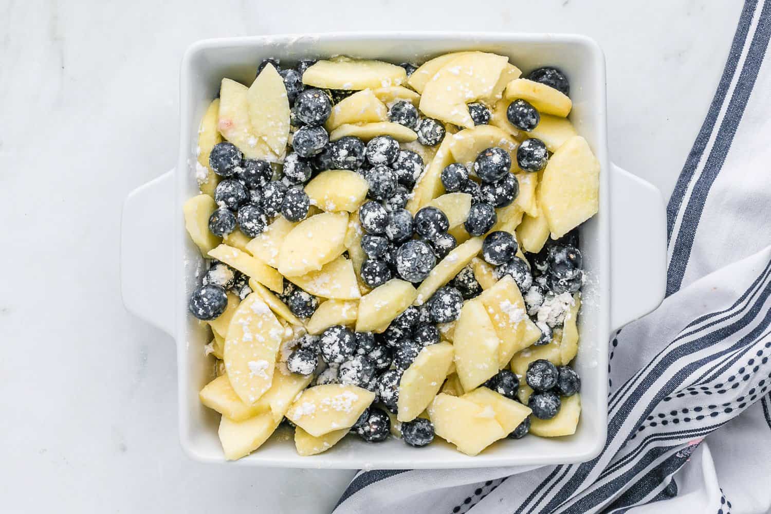 Fruit in baking dish, uncooked.