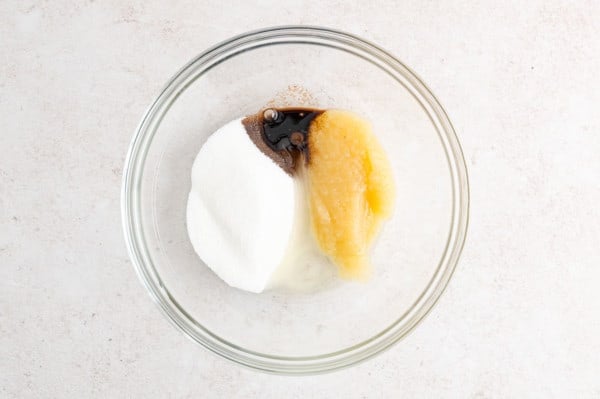 Wet ingredients combined in a glass mixing bowl.