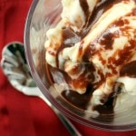 Close up view of hot fudge on vanilla ice cream.