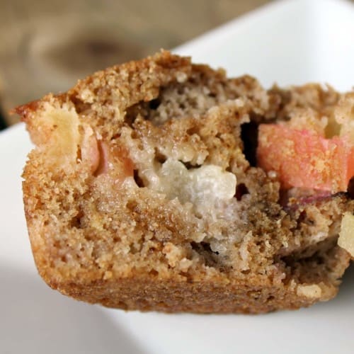 Close up view of a half of an apple cinnamon muffin.