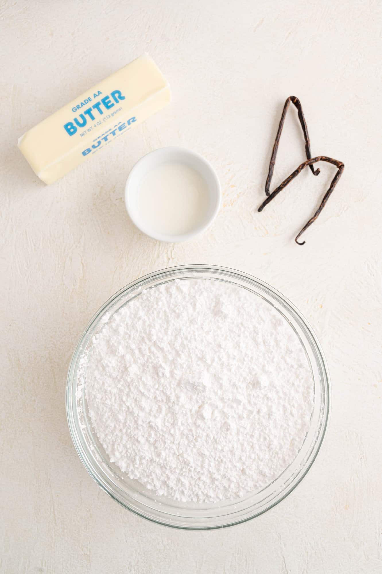 The ingredients for easy vanilla buttercream frosting.