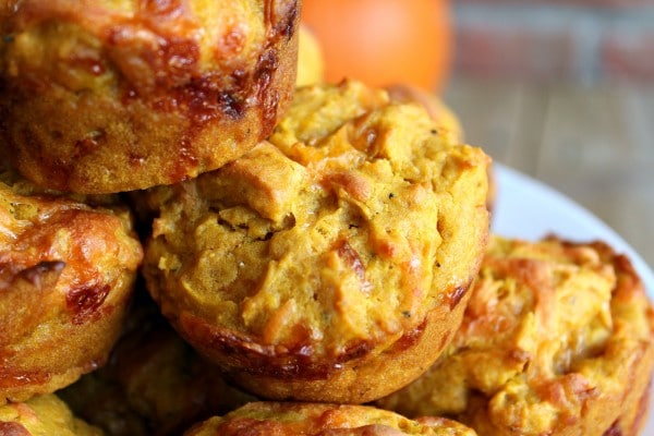 Close up view of pumpkin muffins with cheddar and flecks of black pepper.