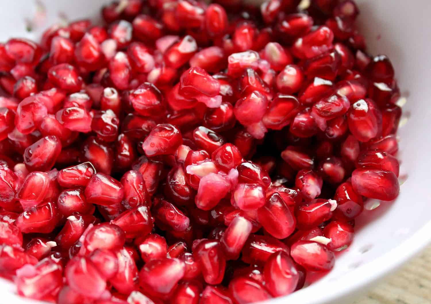 The final result of learning how to cut a pomegranate - a bowl of fresh pomegranate seeds.