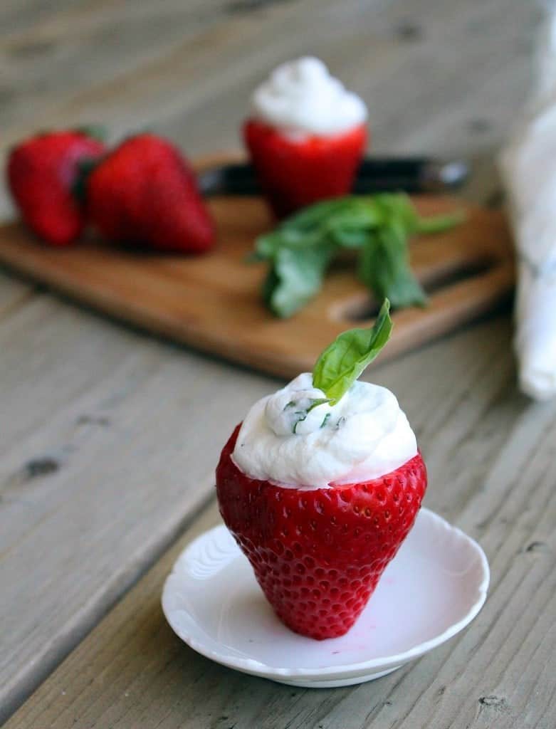 Strawberry stuffed with basil whipped cream photo