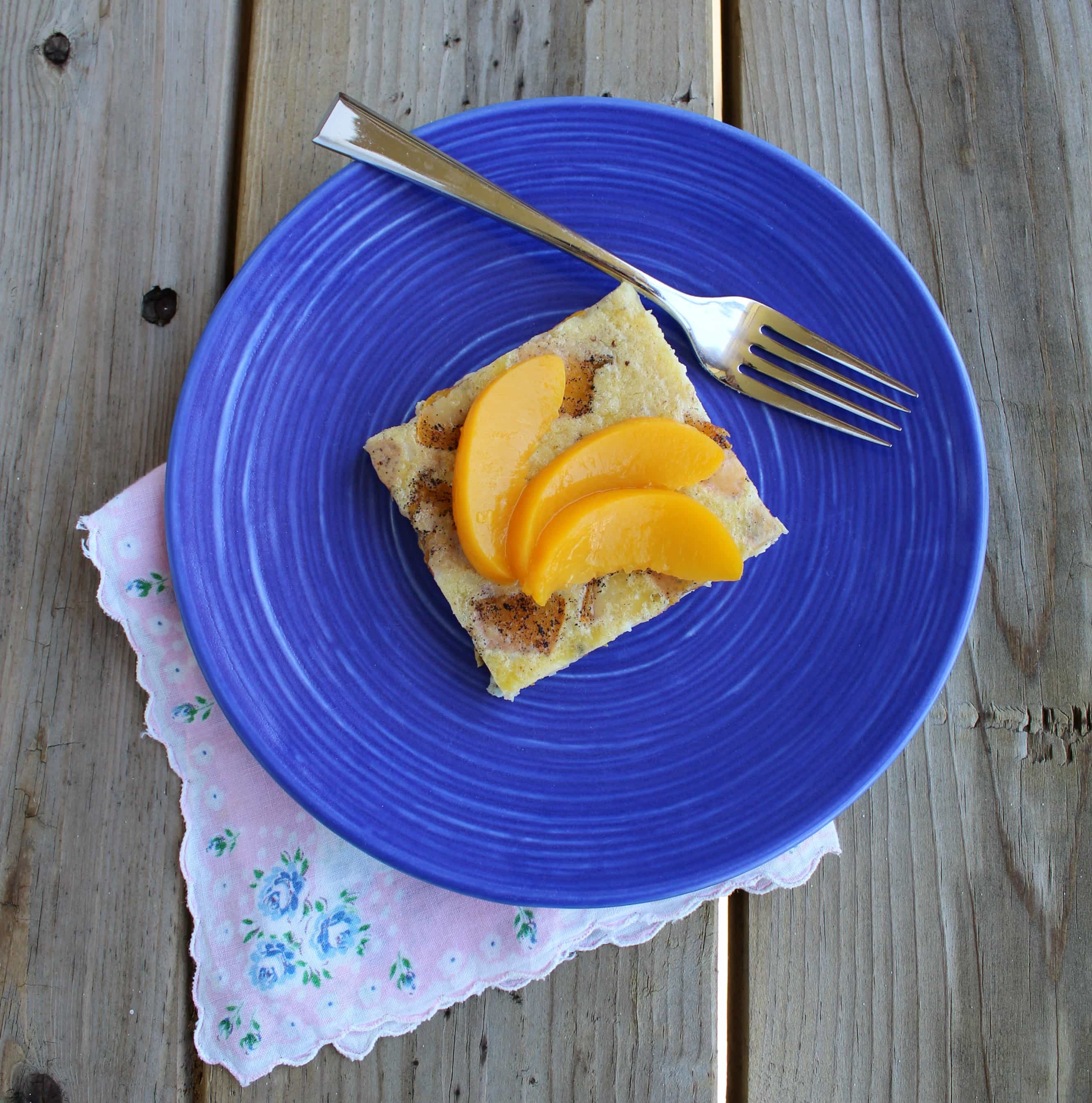 Puffy Peach Pancake with Vanilla Beans - let your breakfast bake while you sip coffee! Get the easy recipe on RachelCooks.com!