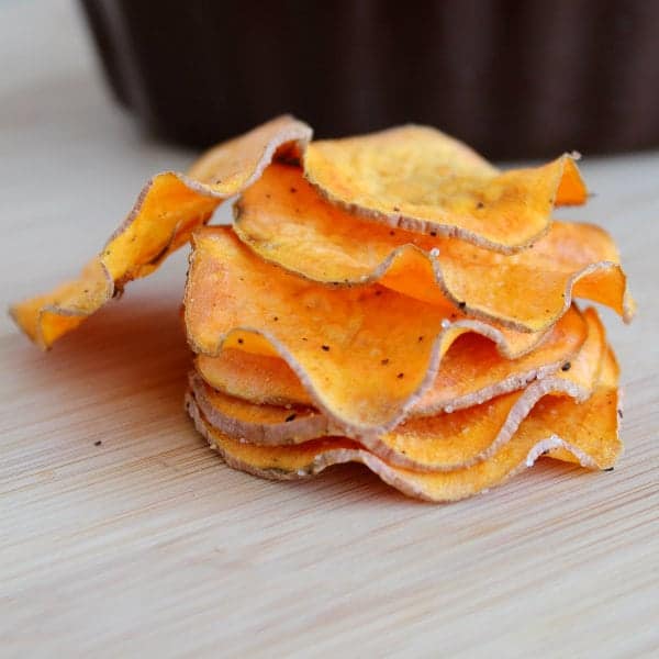 Closeup of stacked sweet potato chips.
