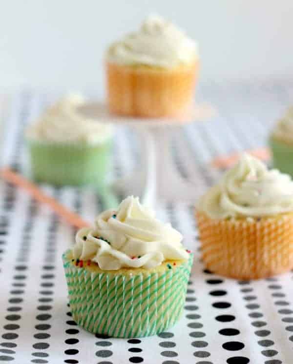 https://www.rachelcooks.com/wp-content/uploads/2013/07/vanilla-cupcakes-surprise-inside-6001.jpg