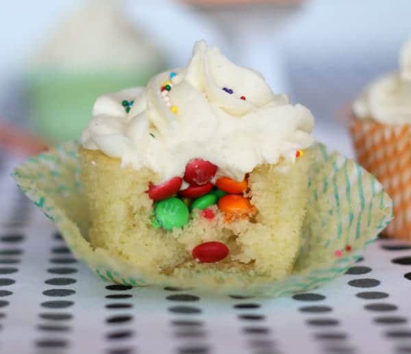 Front view of partially eaten cupcake with surprise filling displayed.