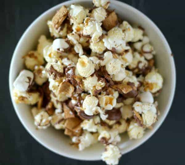 Overhead of round white bowl containing s'more