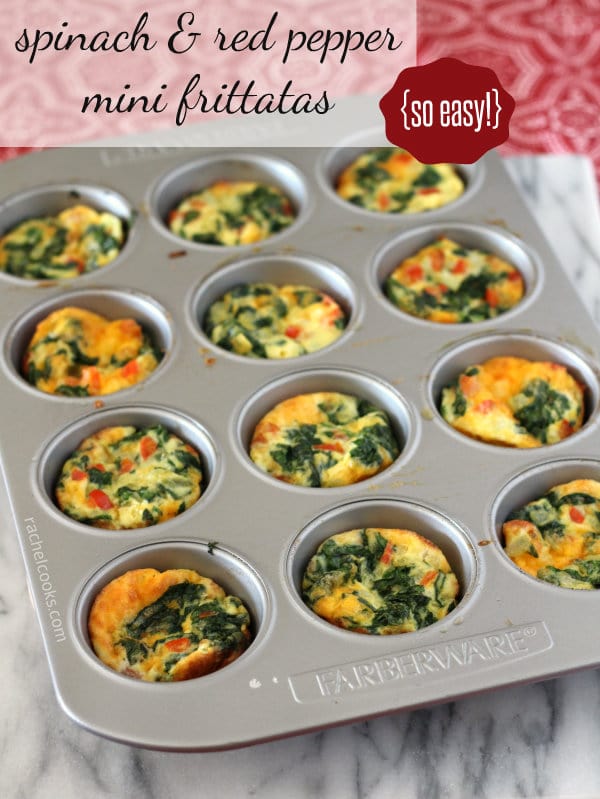 Image of mini frittatas in a muffin tin. They are made with egg, spinach, and red peppers. It is placed on a grey marble background. Text overlay is also present which reads, "spinach & red pepper mini frittatas {so easy!}"