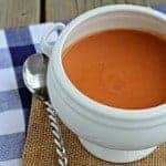 White bowl containing tomato soup.