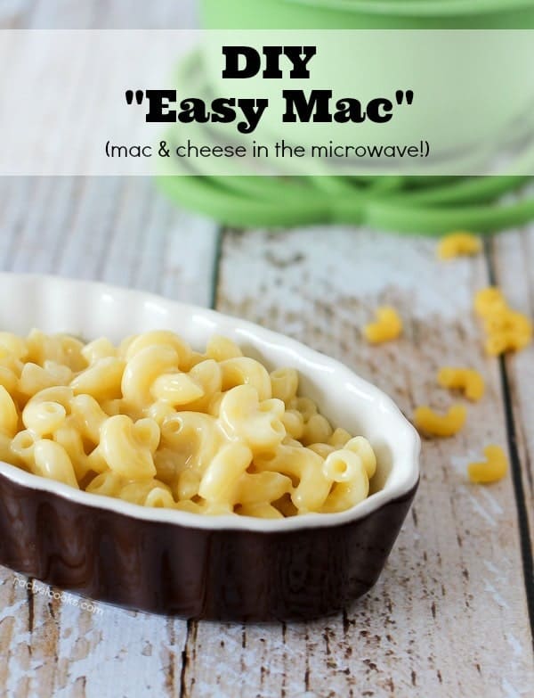 Oval brown bowl of macaroni and cheese on a white wooden background. Text overlay reads, "DIY 'Easy Mac' (mac & cheese in the microwave!)"