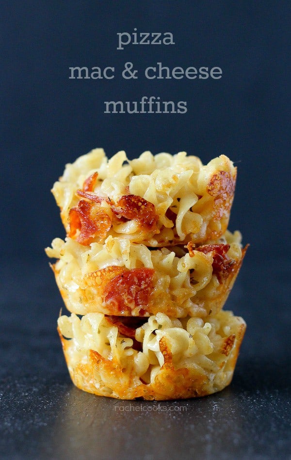 Stack of three mac & cheese muffins on black background. Text overlay reads "pizza mac & cheese muffins."