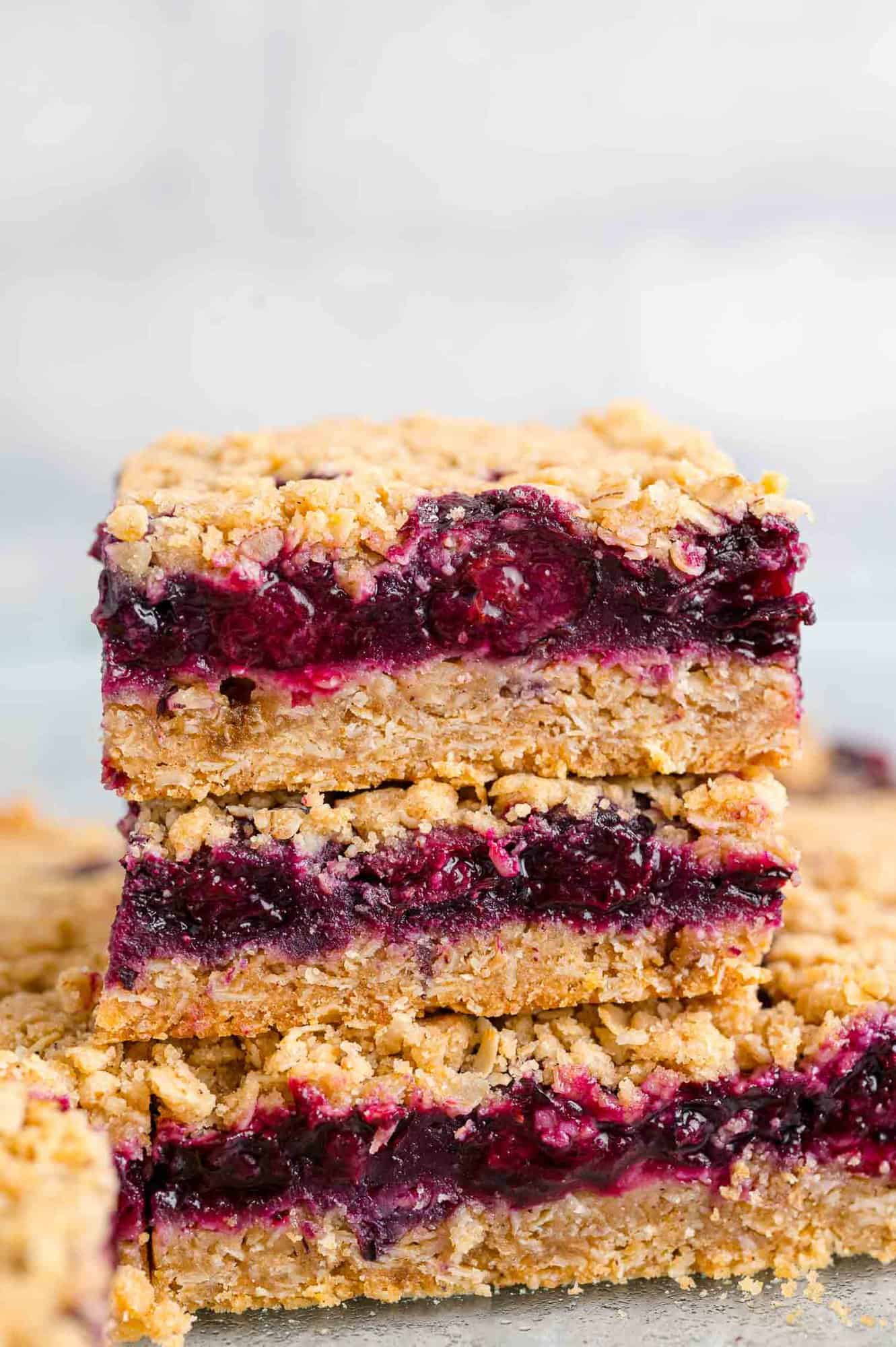3 stacked blueberry crumb bars.