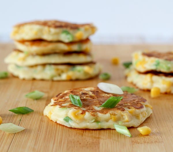 Front view closeup of corn cake with several more in background.