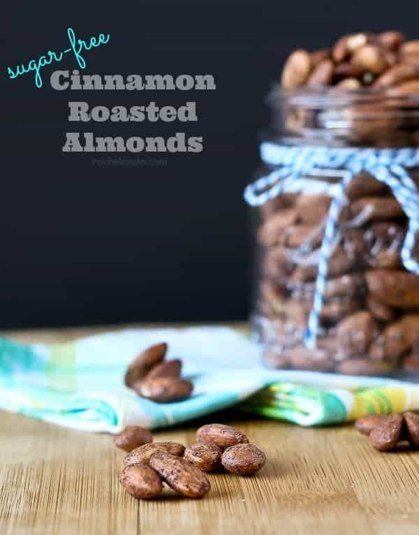 Almonds in a jar and on wooden surface.