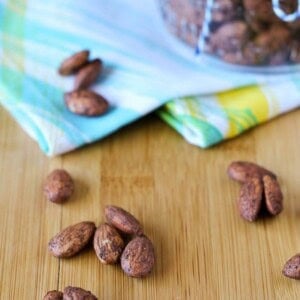 Almonds on a wooden surface.