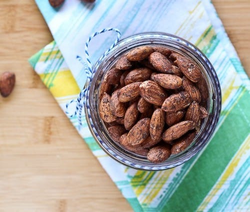 Overhead view of almonds in a jar.