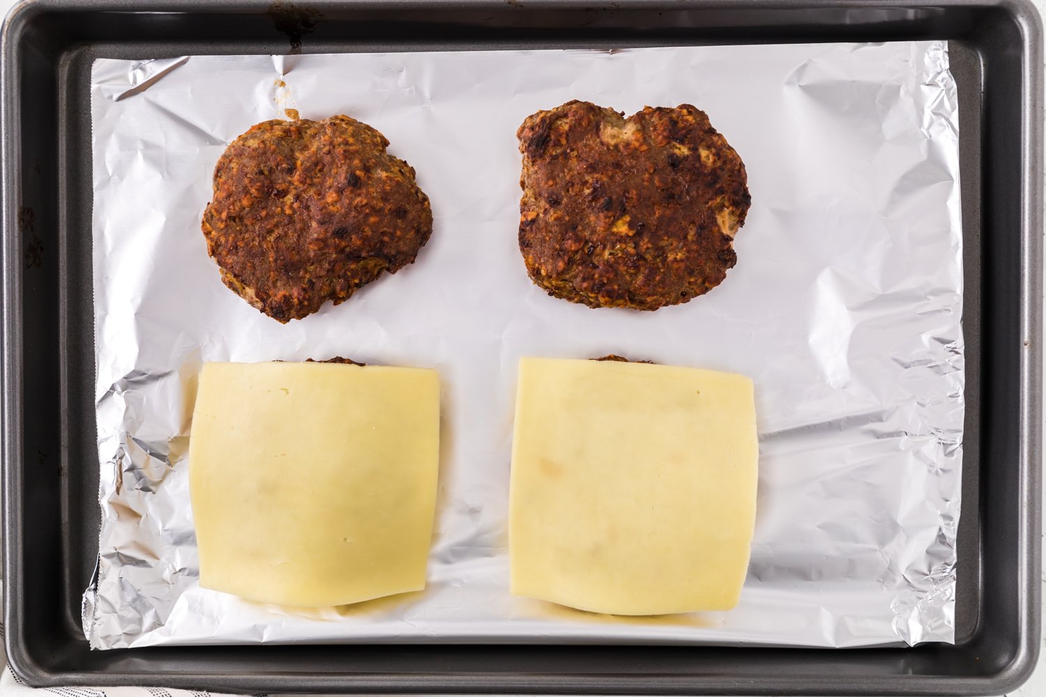 Burger half covered in cheese.