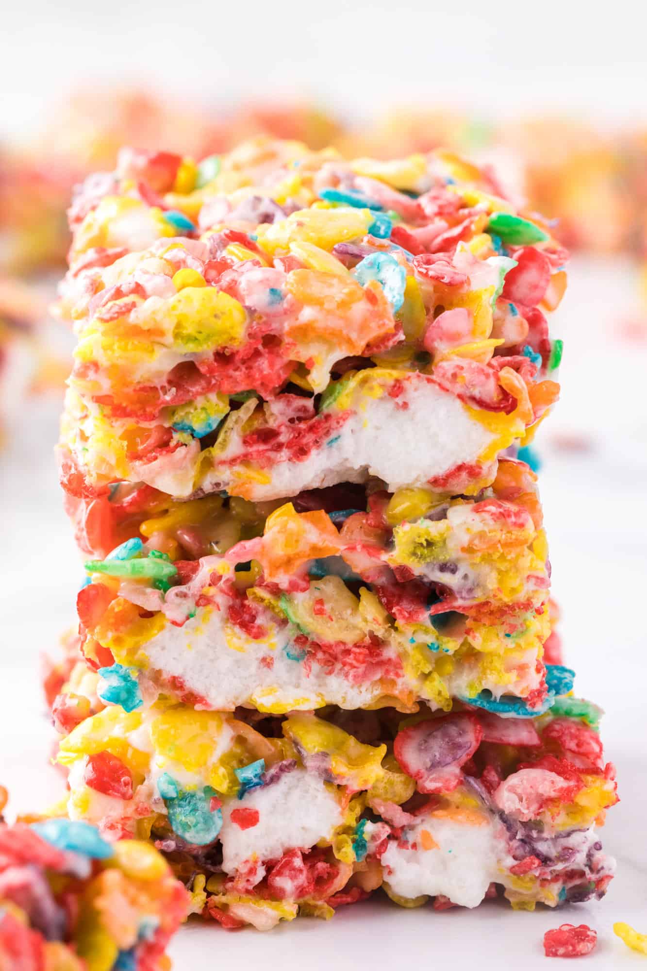 Close up of a stack of three Fruity Pebbles treats.