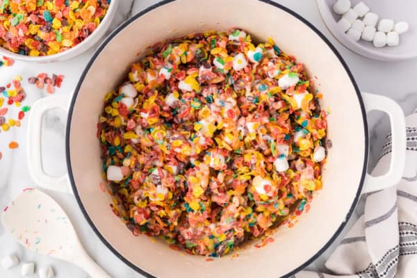 Fruity Pebbles treats are fun, fruity, and gooey no-bake bars made with only 3 ingredients! No one in the family can resist this recipe. Fruity Pebbles treats mixture in a saucepan.