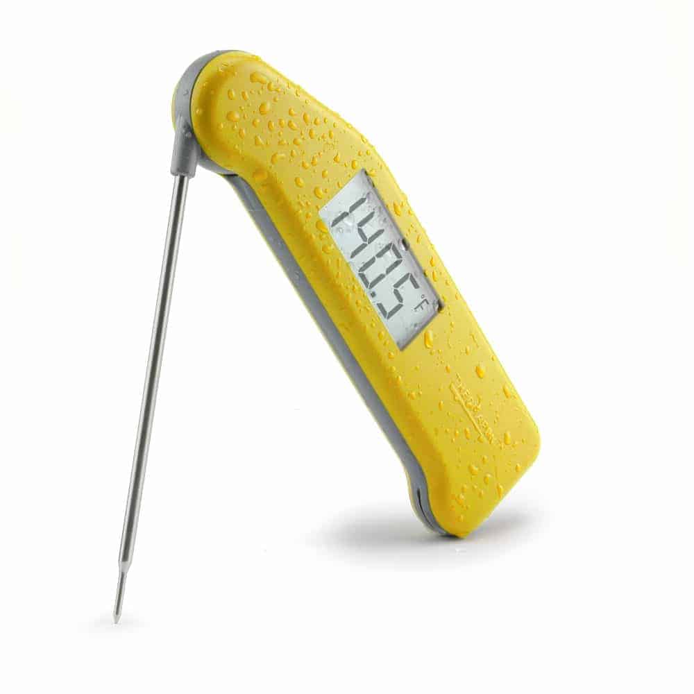 Yellow thermapen on white background.