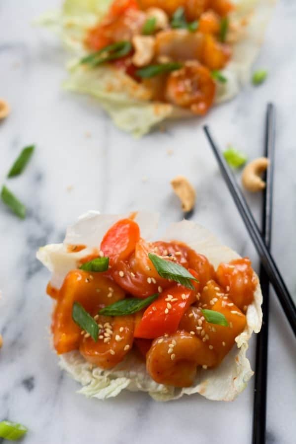 This healthier spin on your favorite Chinese takeout! These Sweet and Sour Shrimp Lettuce Wraps will be ready quicker than calling up an order! Get the recipe on RachelCooks.com!
