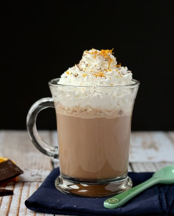 Front view of hot cocoa with black background.