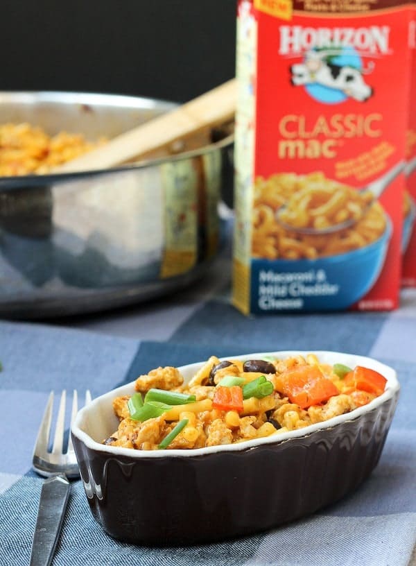 A serving of mac and cheese with pan in background, also box of Horizon Classic Mac and Cheese.