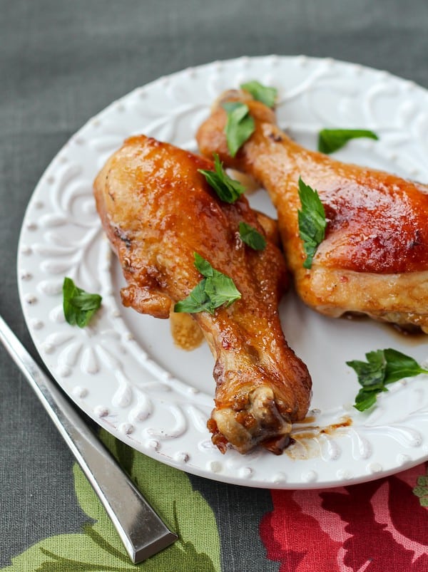 Drumsticks on white plate.
