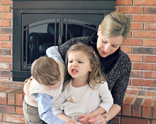 Mom with two toddlers, fighting