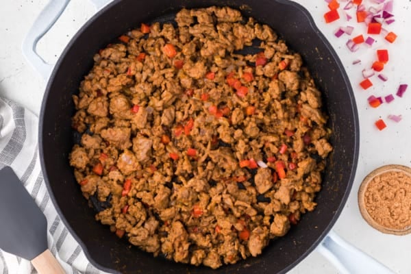 Sauteed ground turkey taco meat in a cast iron skillet.