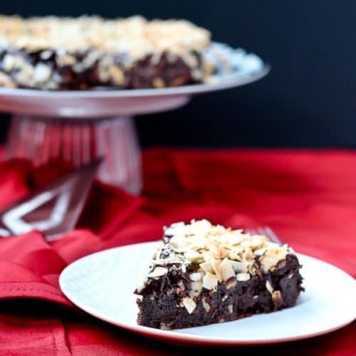 Decadent Flourless Chocolate Cake with Chocolate Ganache and Toasted Coconut - Get the (easy!) recipe on RachelCooks.com