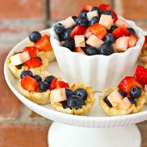 These Mini Patriotic Fruit Tarts are beautiful, easy to make, and a refreshing treat for Memorial Day, Independence Day, or ANY day! Get the EASY recipe on RachelCooks.com!