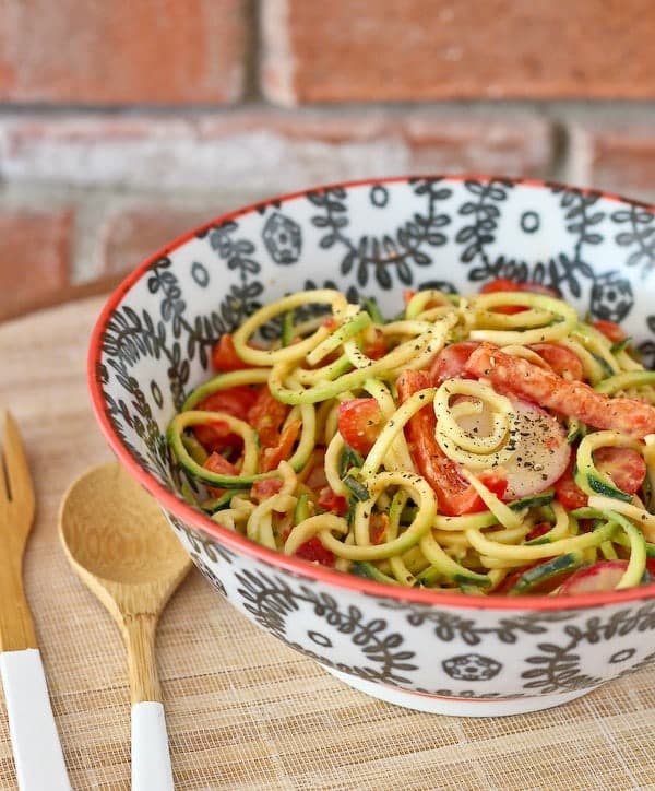 Zucchini Noodle Salad with Roasted Red Pepper Hummus Dressing - get the easy salad recipe on RachelCooks.com! 