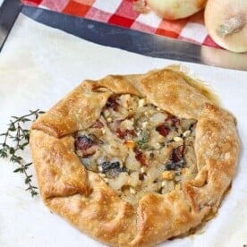 Vidalia Onion Tart with Bacon, Kale, and Thyme - aka the best thing you'll ever eat. Get the easy recipe on RachelCooks.com!