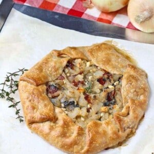 Vidalia Onion Tart with Bacon, Kale, and Thyme - aka the best thing you'll ever eat. Get the easy recipe on RachelCooks.com!