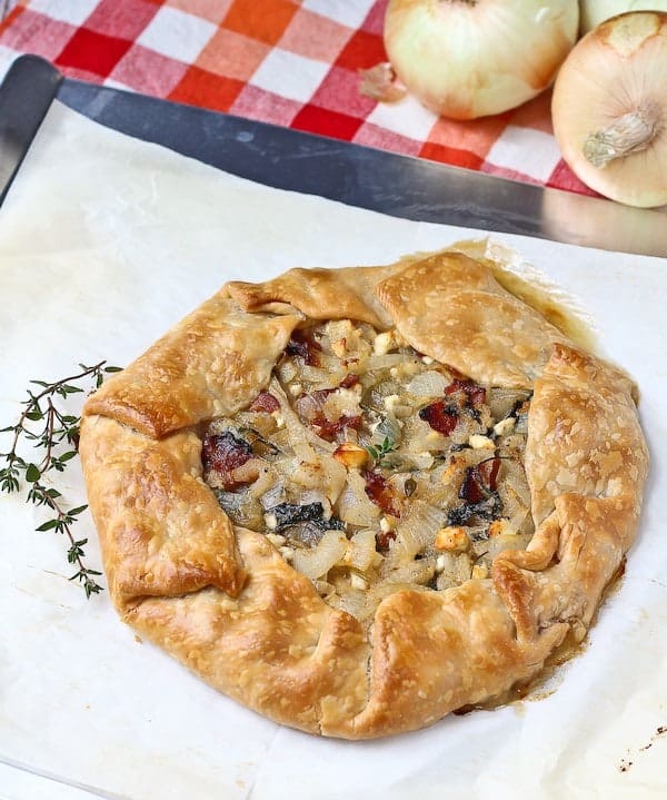 Vidalia Onion Tart with Bacon, Kale, and Thyme - aka the best thing you'll ever eat. Get the easy recipe on RachelCooks.com!