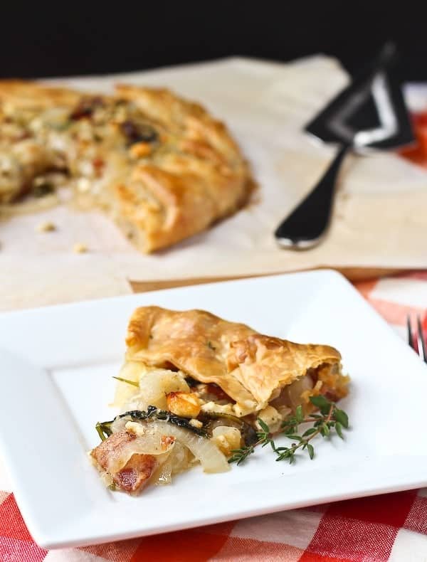 Vidalia Onion Tart with Bacon, Kale, and Thyme - aka the best thing you'll ever eat. Get the easy recipe on RachelCooks.com!