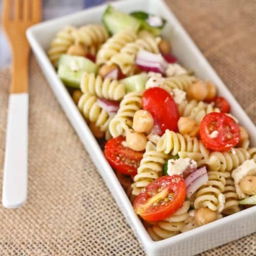 Greek Pasta Salad with Feta - this is a easy, filling, and delicious pasta salad that is perfect for picnics and bbqs. Get the easy recipe on RachelCooks.com!