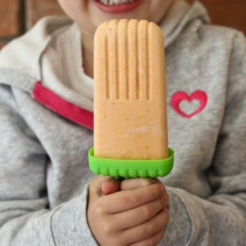 This Healthy Orange Creamsicle is a great summertime treat - Greek yogurt makes the creamsicle a fantastic snack! PS: Only three ingredients! Recipe on RachelCooks.com!