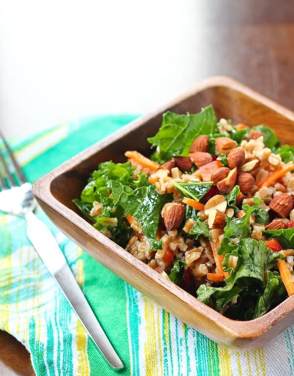 This kale salad keeps really well in your fridge - great for healthy eating all week! The honey dijon dressing softens the kale perfectly. Get the healthy recipe on RachelCooks.com. Great for weekly meal prep fans!