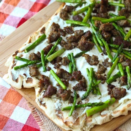 Grilled Pizza with Ricotta, Sausage and Asparagus - Get the easy recipe that's perfect for summer on RachelCooks.com!