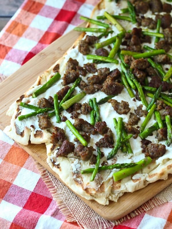 Grilled Pizza with Ricotta, Sausage and Asparagus - Get the easy recipe that's perfect for summer on RachelCooks.com! 
