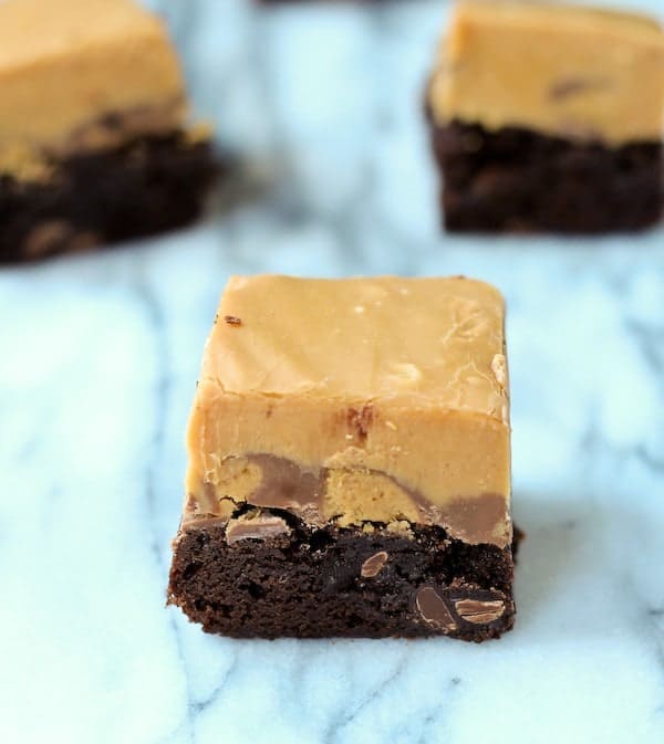 Closeup of peanut butter fudge brownie, showing two layers.