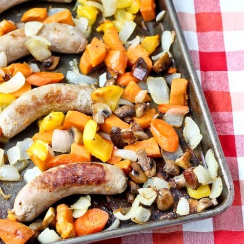 Roasted sausage and vegetables on sheet pan.