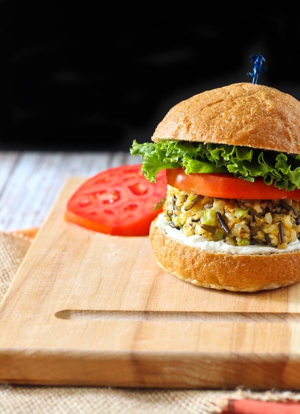 Wild rice burger with lettuce and tomato.