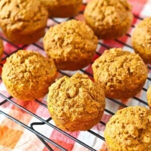 Pumpkin bran muffins on a wire rack.
