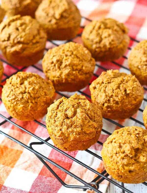 Pumpkin bran muffins on a wire rack.