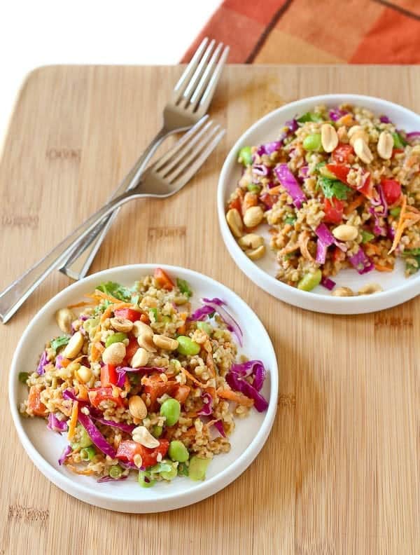 This Thai freekeh salad with peanut ginger dressing packs a punch of flavor and nutrition. It keeps great in the fridge - perfect for weekend food prep! Get the easy and healthy recipe on RachelCooks.com! 